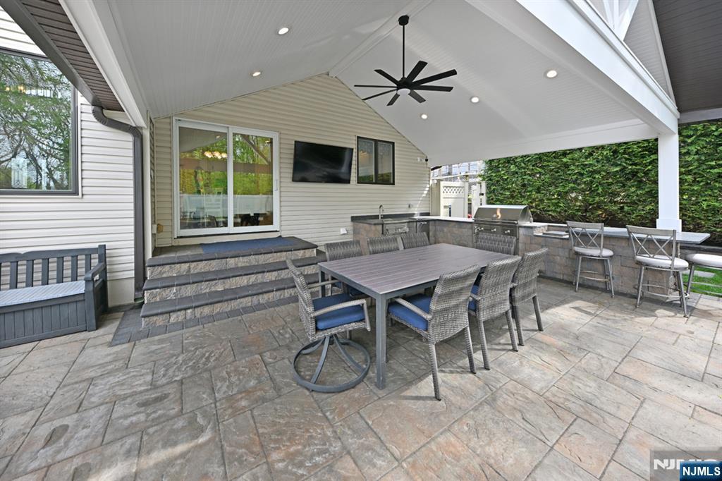 106 Arnot Place Paramus, NJ 07652 - Photo 36 of 48 a view of a dining room with furniture window and outside view