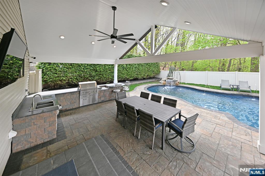 106 Arnot Place Paramus, NJ 07652 - Photo 38 of 48 a outdoor space with lots of tables a garden and chairs