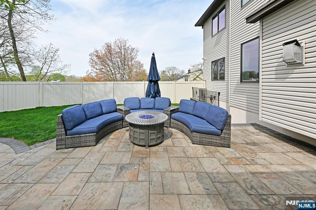 106 Arnot Place Paramus, NJ 07652 - Photo 39 of 48 a view of a patio with couches chairs and potted plants