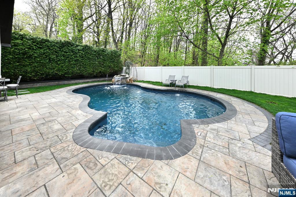 106 Arnot Place Paramus, NJ 07652 - Photo 40 of 48 a view of a swimming pool with a patio
