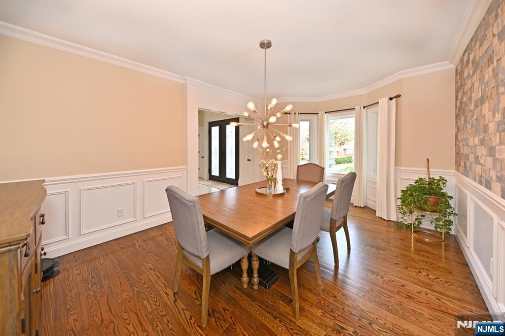 106 Arnot Place Paramus, NJ 07652 - Photo 5 of 48 a view of a dining room with furniture window and wooden floor