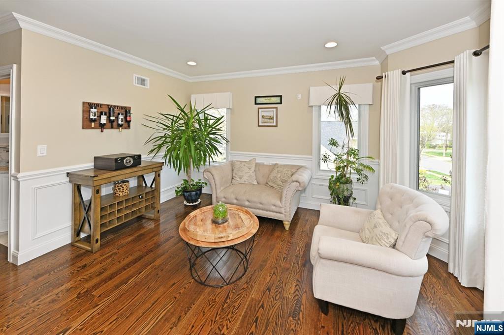 106 Arnot Place Paramus, NJ 07652 - Photo 7 of 48 a living room with furniture and a potted plant
