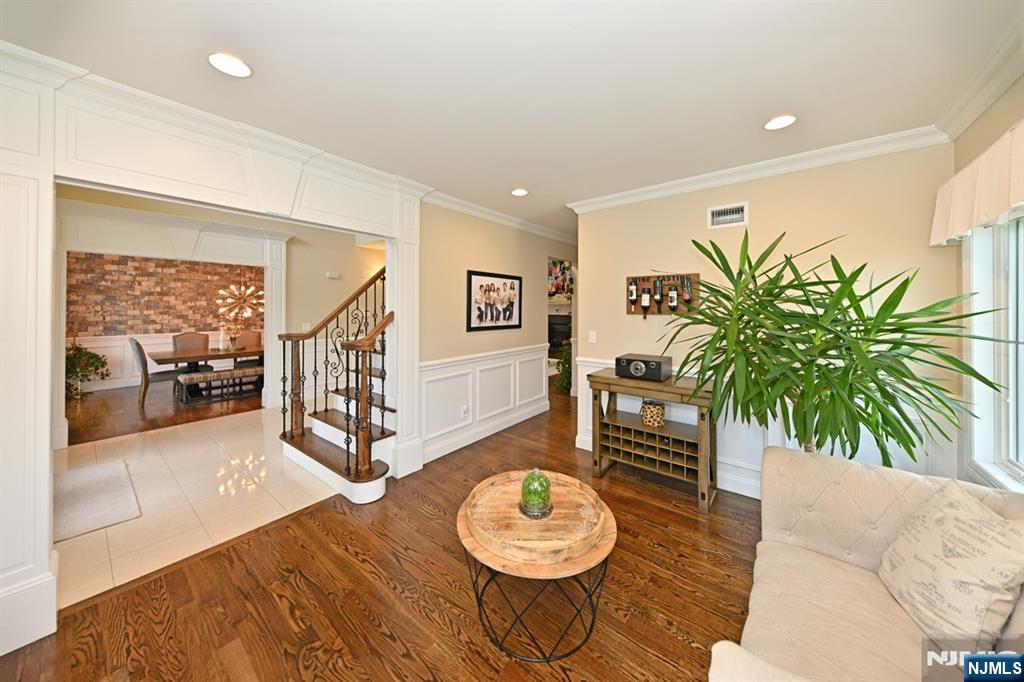 106 Arnot Place Paramus, NJ 07652 - Photo 8 of 48 a living room with furniture and a wooden floor
