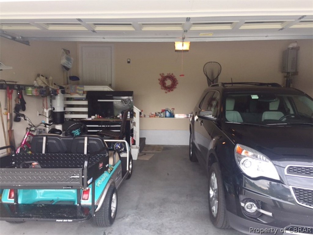 740 Marsh Pungo Road Locust Hill, VA 23092 - Photo 25 of 26 1 1/2 car attached garage with auto door opener