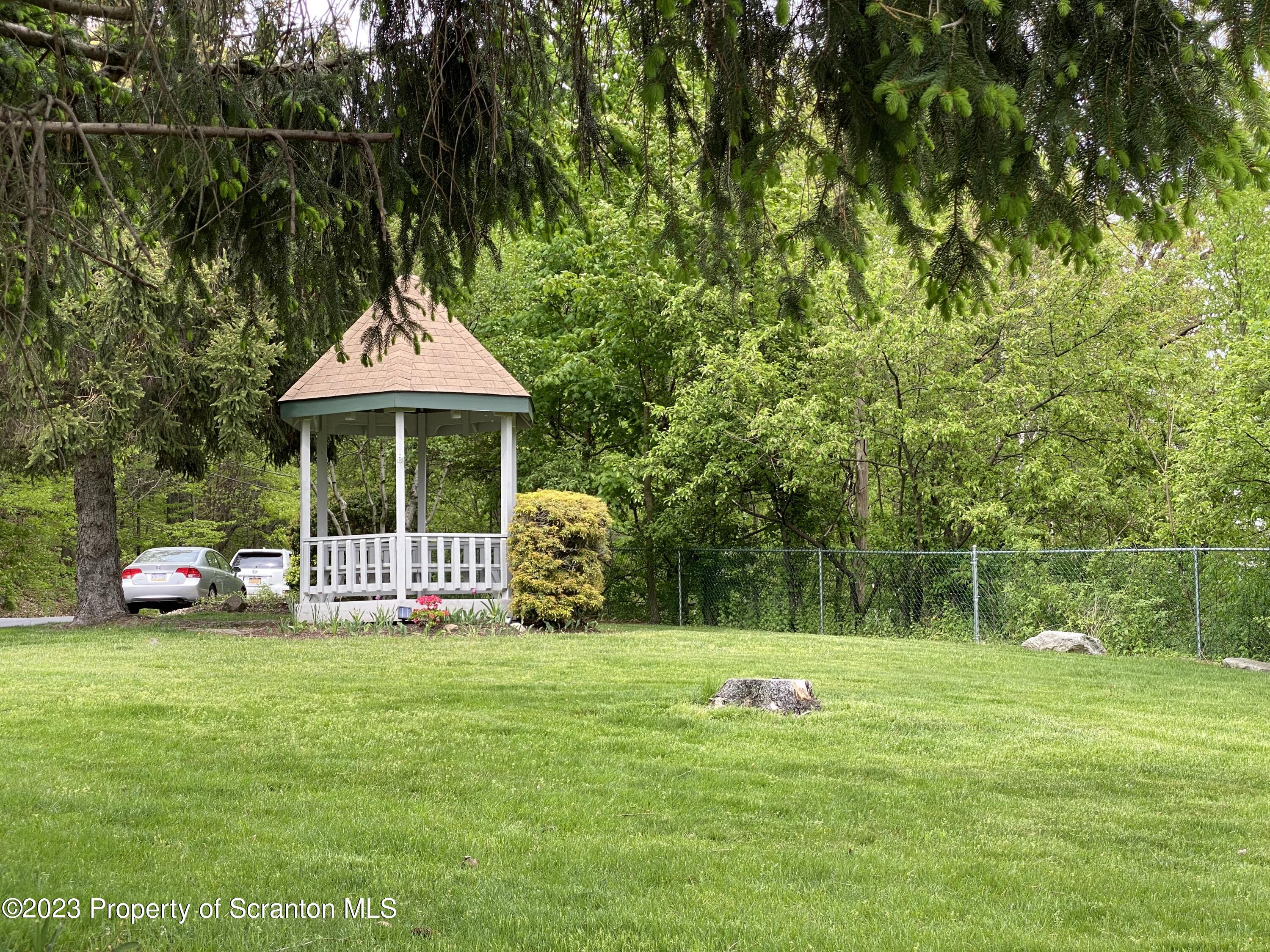 1112 Summit Pointe Scranton, PA 18508 - Photo 29 of 29 a front view of a house with garden