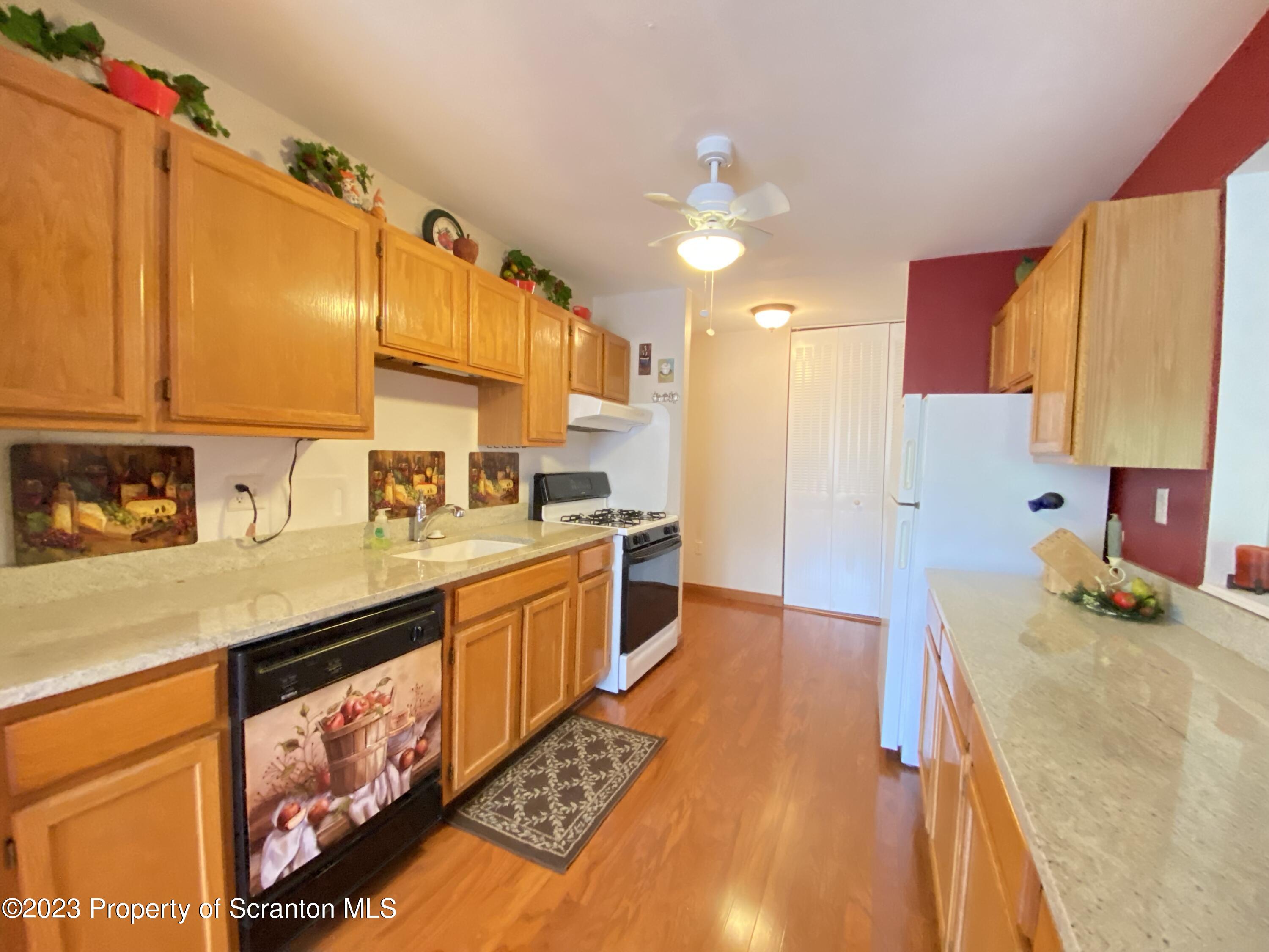 1112 Summit Pointe Scranton, PA 18508 - Photo 7 of 29 a kitchen with a sink stove and cabinets