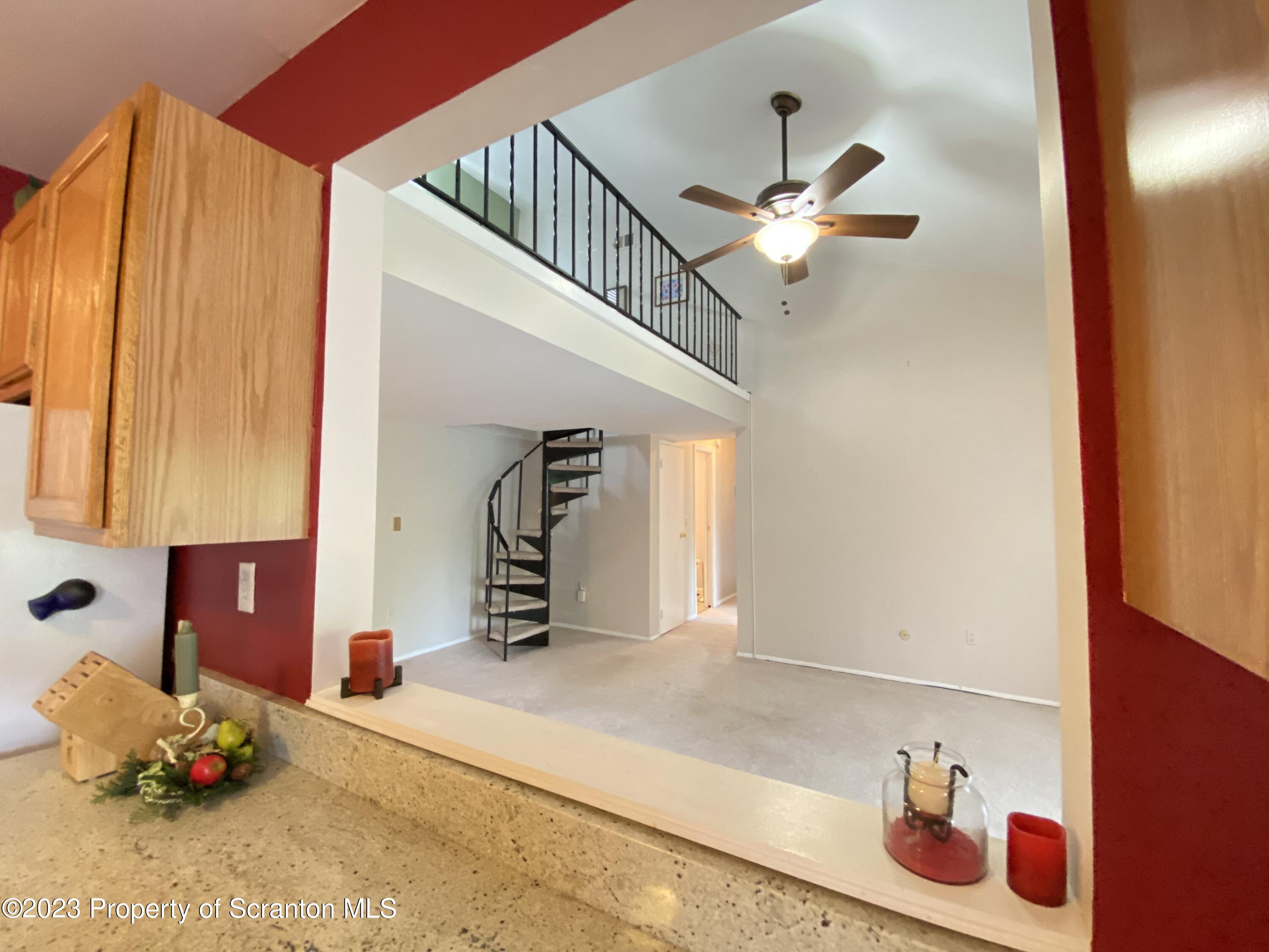 1112 Summit Pointe Scranton, PA 18508 - Photo 8 of 29 a kitchen with a refrigerator and ceiling fan