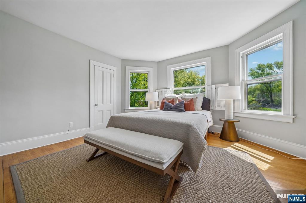 215 Inwood Avenue Montclair, NJ 07043 - Photo 28 of 50 a bedroom with a bed and window