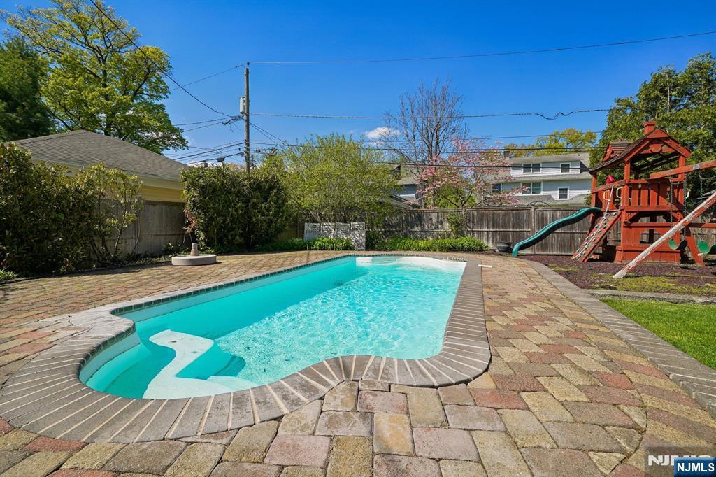 215 Inwood Avenue Montclair, NJ 07043 - Photo 47 of 50 a view of a swimming pool with a garden