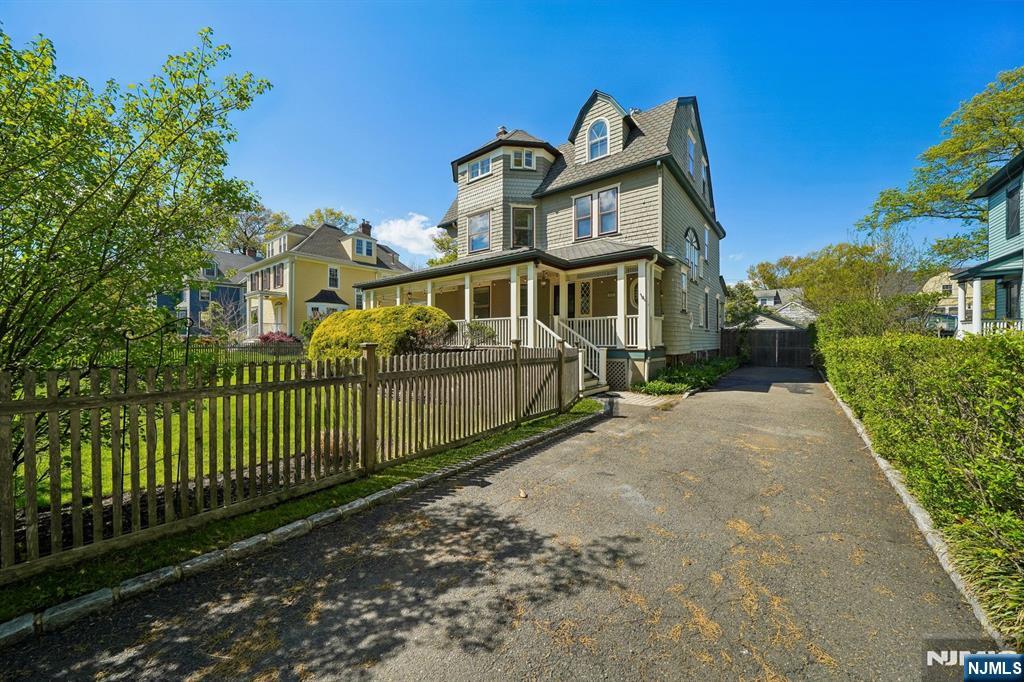 215 Inwood Avenue Montclair, NJ 07043 - Photo 48 of 50 a front view of a house with a garden