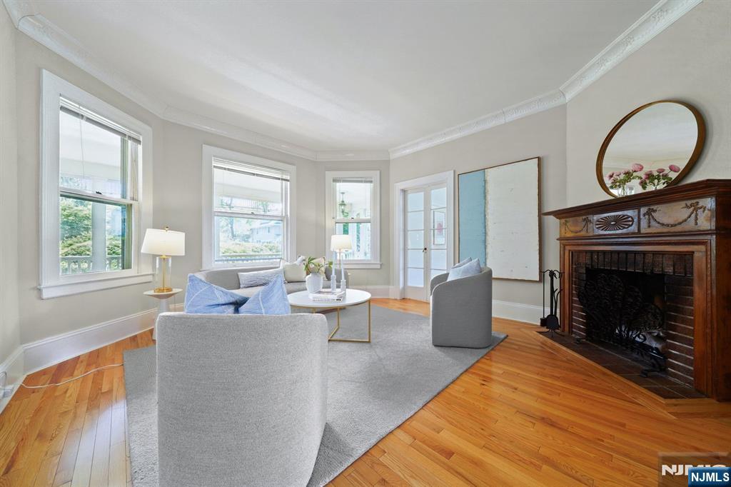 215 Inwood Avenue Montclair, NJ 07043 - Photo 10 of 50 a living room with furniture a window and a fireplace