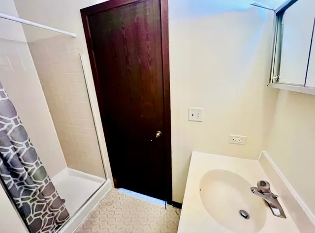 a bathroom with a sink and a mirror