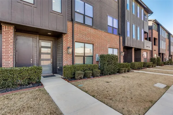 a view of a building with a yard