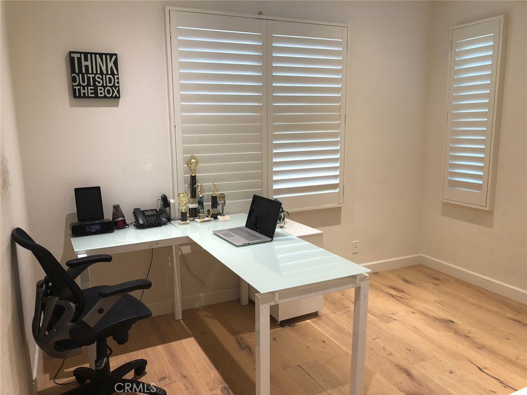88 Lupari Irvine, CA 92618 - Photo 11 of 33 a view of a workspace with furniture and a window