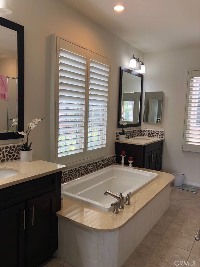 88 Lupari Irvine, CA 92618 - Photo 13 of 33 a bath tub sitting next to a bathroom sink