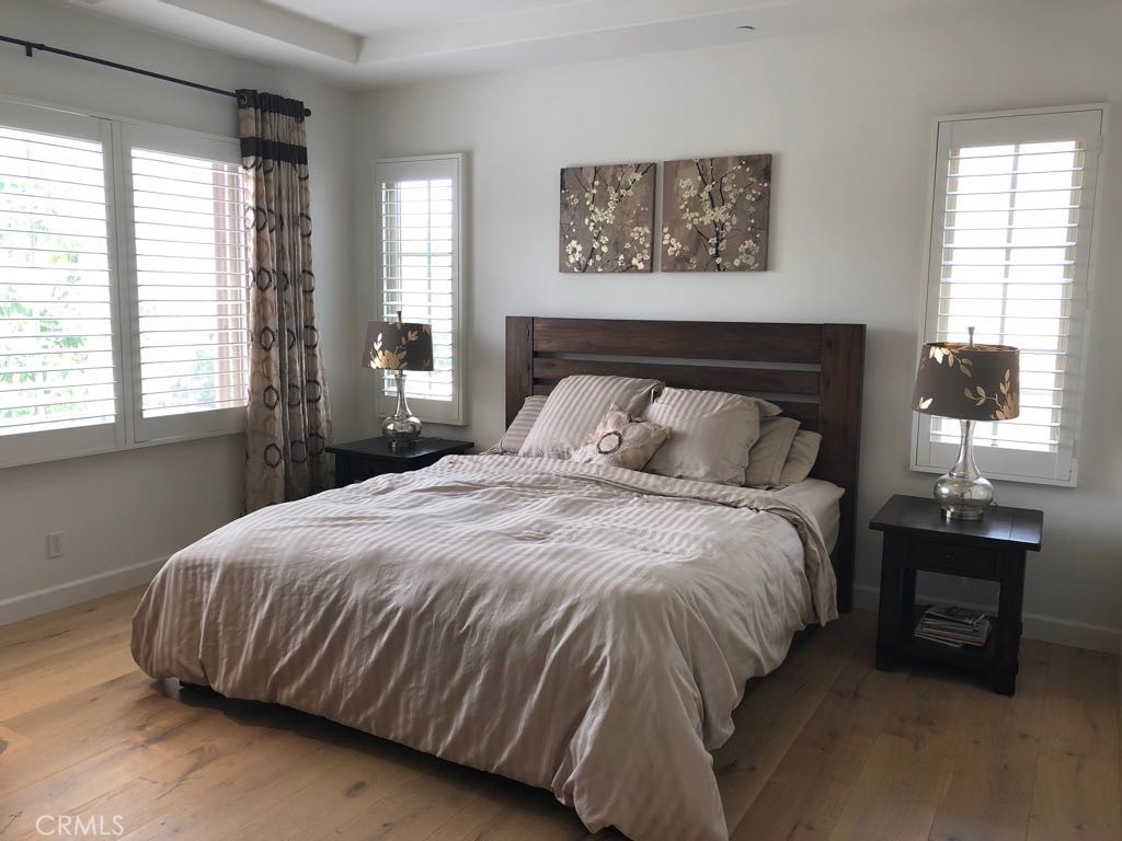 88 Lupari Irvine, CA 92618 - Photo 14 of 33 a bedroom with a bed and window