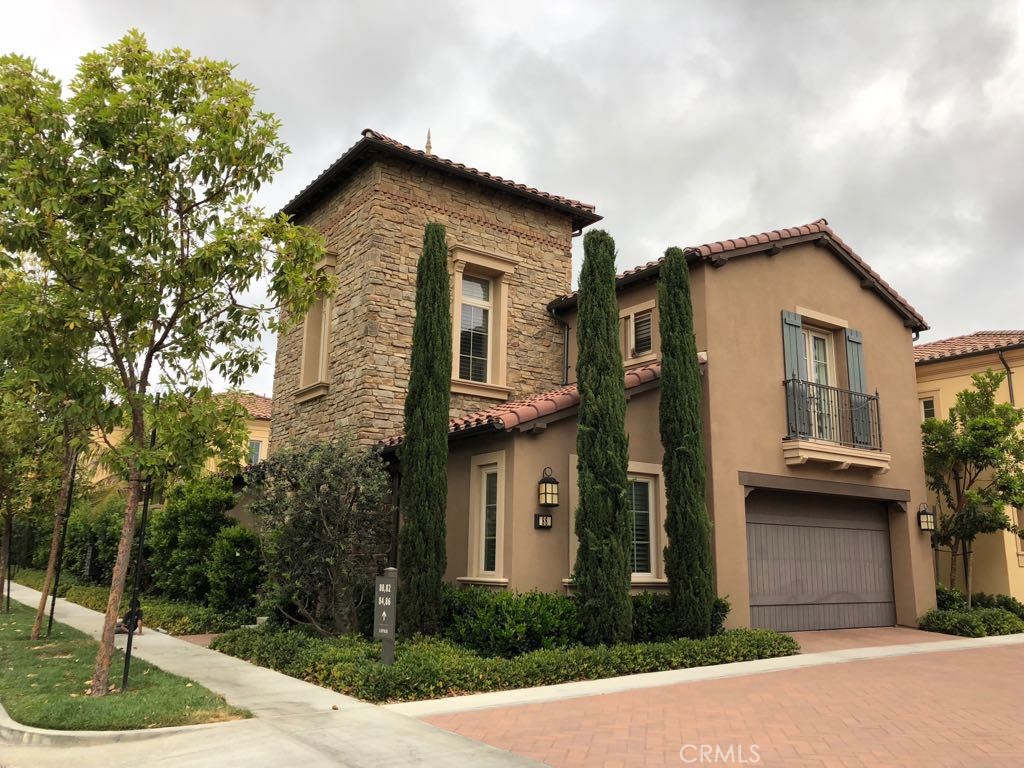 88 Lupari Irvine, CA 92618 - Photo 2 of 33 a front view of a house with a garden