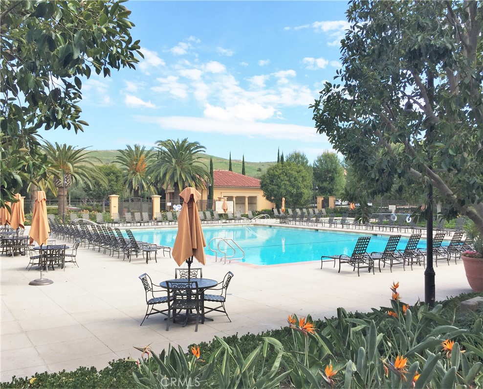 88 Lupari Irvine, CA 92618 - Photo 24 of 33 a view of a lake with a table and chairs