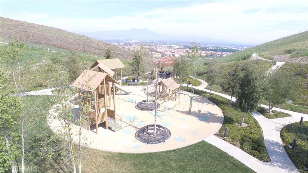 88 Lupari Irvine, CA 92618 - Photo 25 of 33 a view of a terrace with a table and chairs