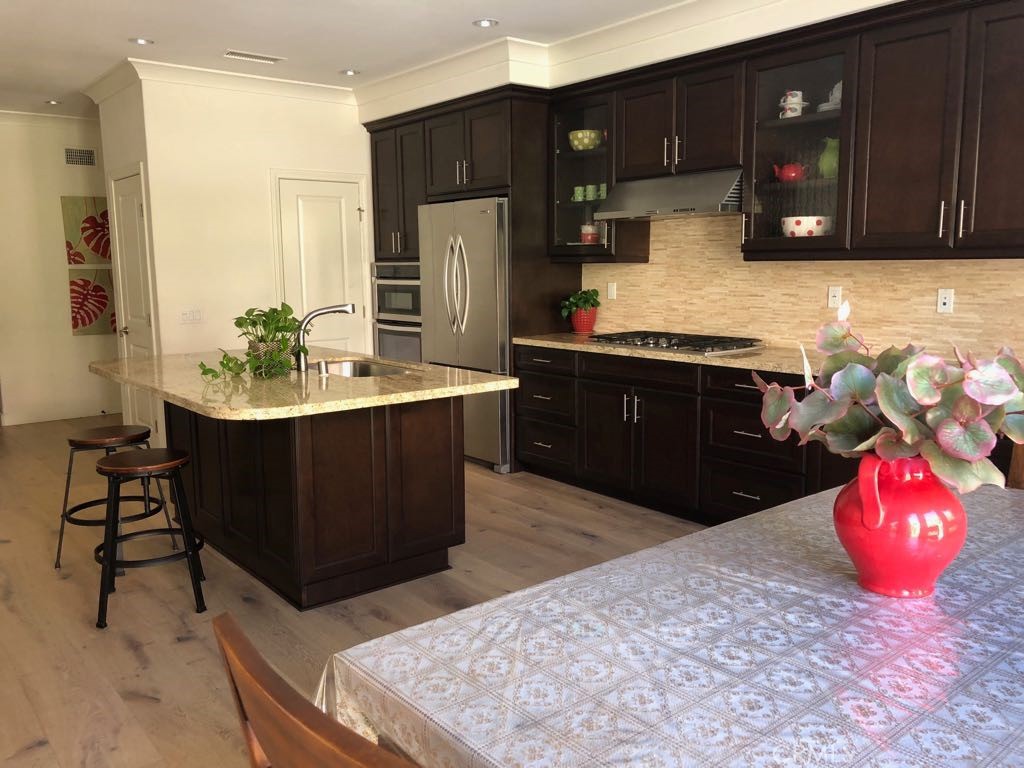 88 Lupari Irvine, CA 92618 - Photo 4 of 33 a kitchen with a sink refrigerator and cabinets
