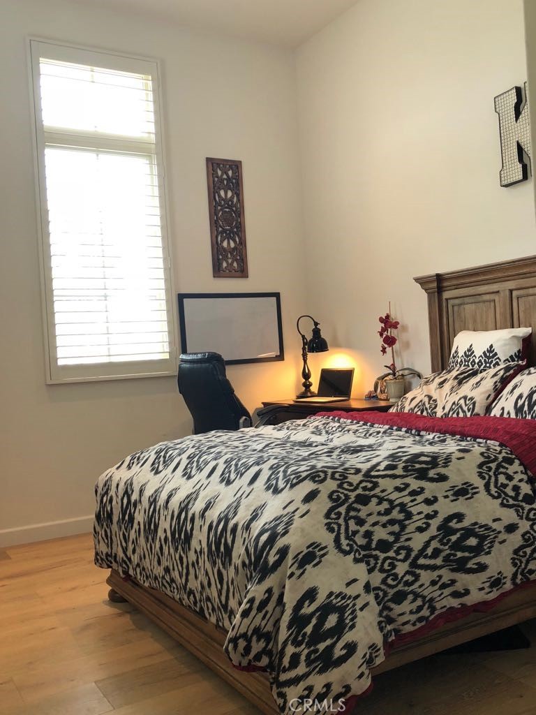 88 Lupari Irvine, CA 92618 - Photo 8 of 33 a bedroom with a bed and window