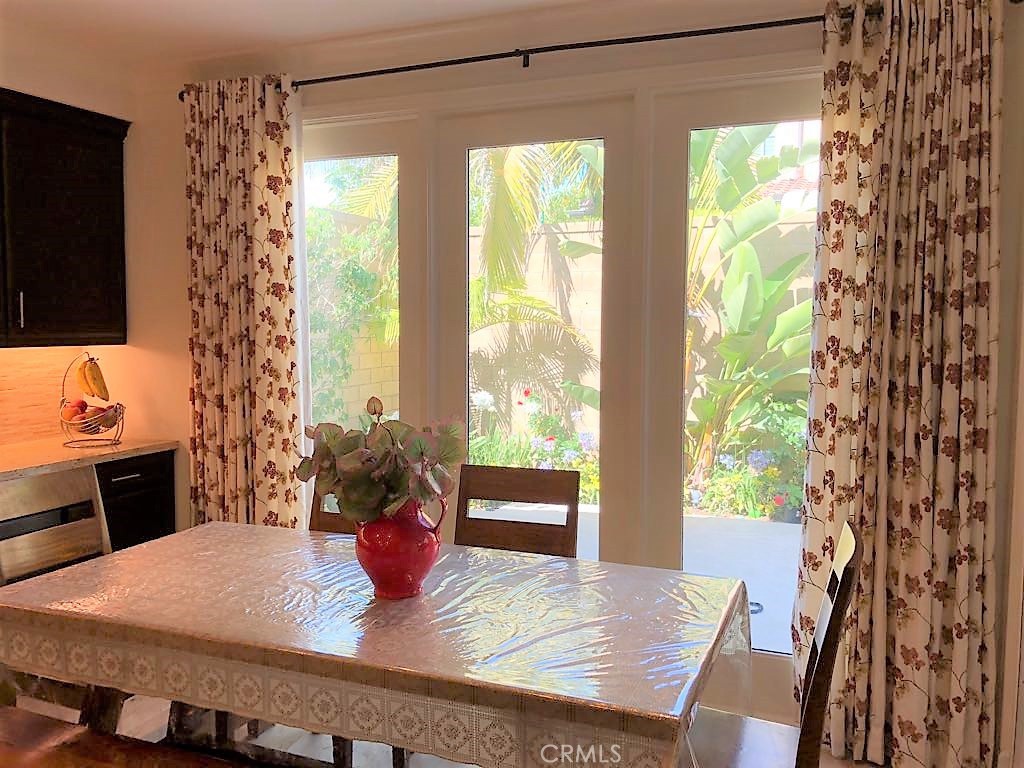 88 Lupari Irvine, CA 92618 - Photo 9 of 33 a dining room with furniture window and wooden floor