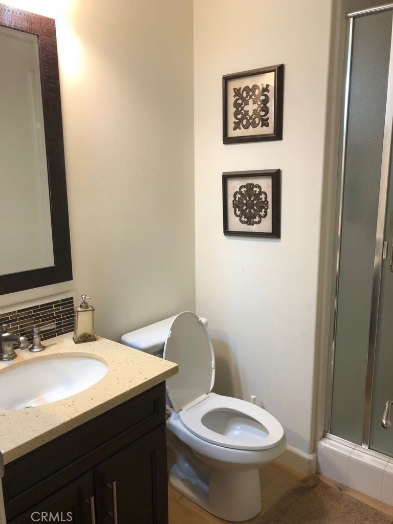 88 Lupari Irvine, CA 92618 - Photo 10 of 33 a bathroom with a toilet a sink and mirror