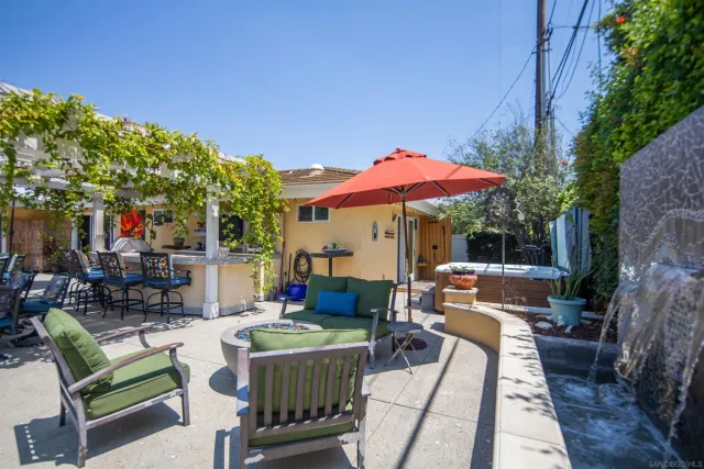a view of a patio with a dining table and chairs