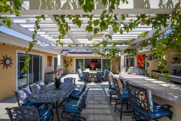a view of the patio with dining table and chairs