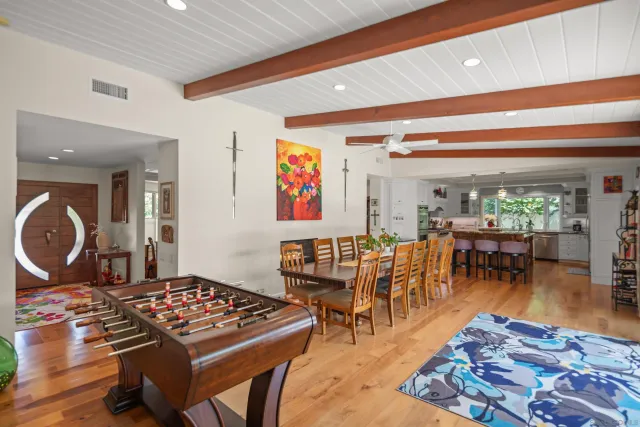 a bedroom with a bed and a potted plant
