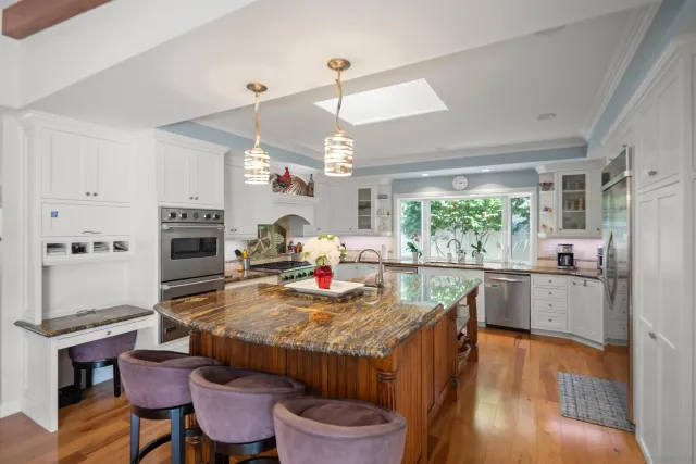 a kitchen with a stove a sink and a microwave