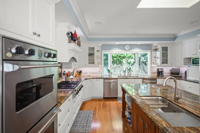 a bedroom with a large bed and a large window