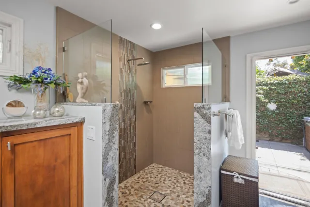 a spacious bedroom with a bed and wooden floor