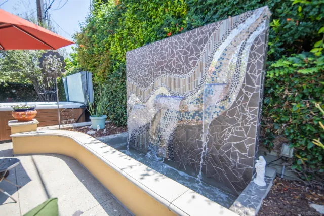 a backyard of a house with a garden and plants