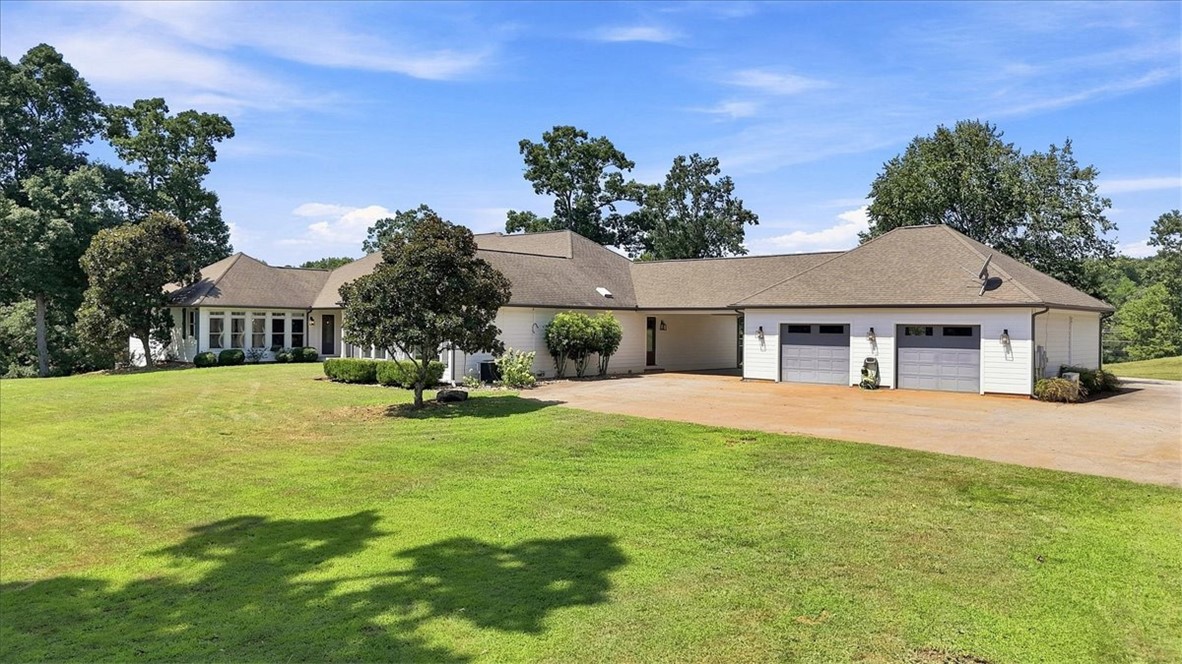 181 Sentell Road Williamston, SC 29697 - Photo 44 of 46 Sprawling architectural lines define this single-story residence complete with an attached multi-car garage and a large detached garage with office.