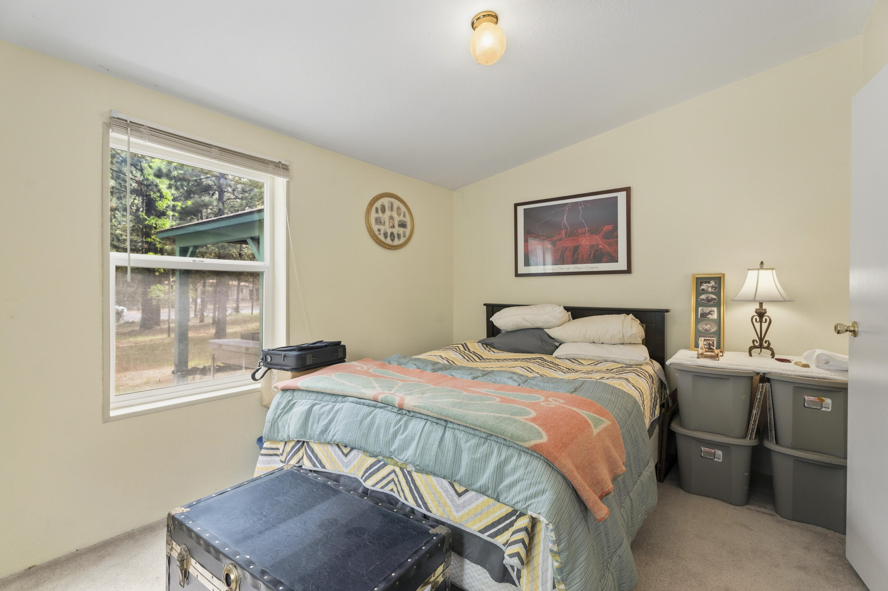 16928 Covina Road Bend, OR 97707 - Photo 19 of 48 a bedroom with a bed and a window