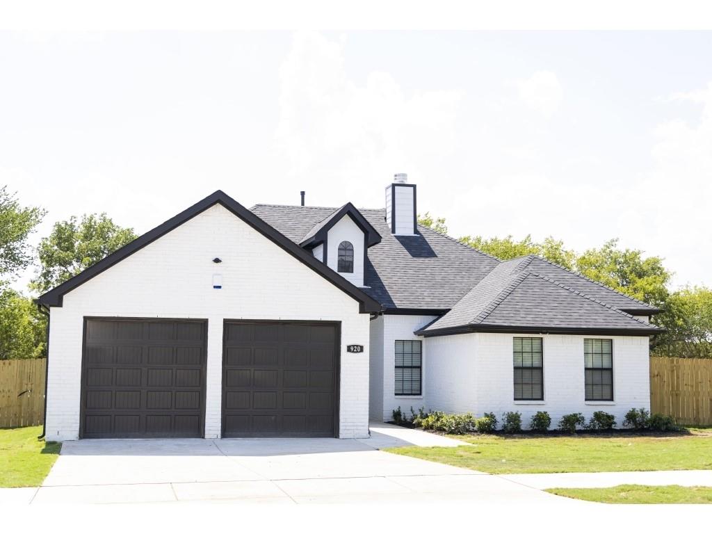 920 Williams Road Fort Worth, TX 76120 - Photo 1 of 1 a front view of a house with a yard and garage