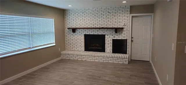 a view of a fireplace in an empty room