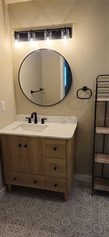 a bathroom with a sink and a mirror