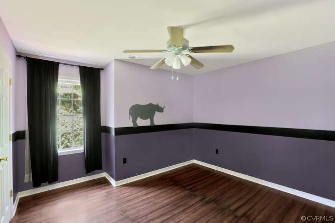 1554 Walkers Ridge Road Powhatan, VA 23139 - Photo 15 of 24 Bedroom with laminate flooring and double closets
