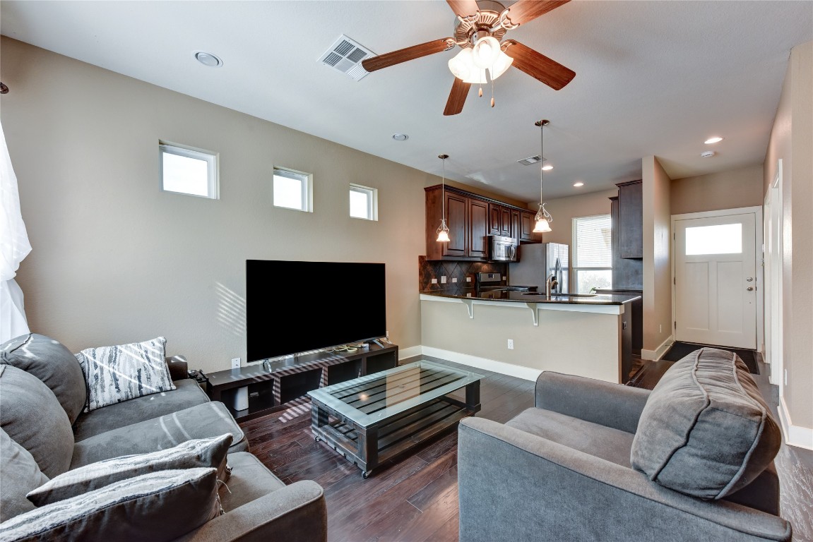 12212 Tawny Farms Road, Unit 142 Austin, TX 78748 - Photo 12 of 38 a living room with furniture and a flat screen tv
