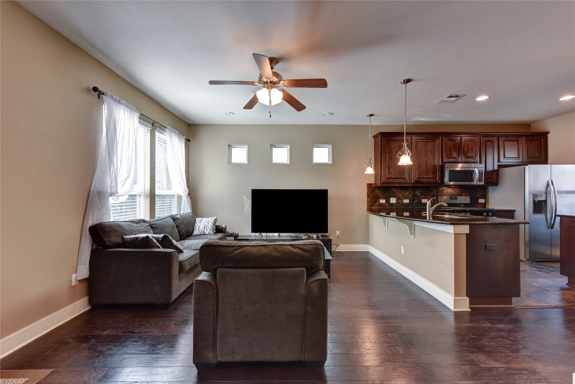 12212 Tawny Farms Road, Unit 142 Austin, TX 78748 - Photo 13 of 38 a living room with furniture and kitchen view