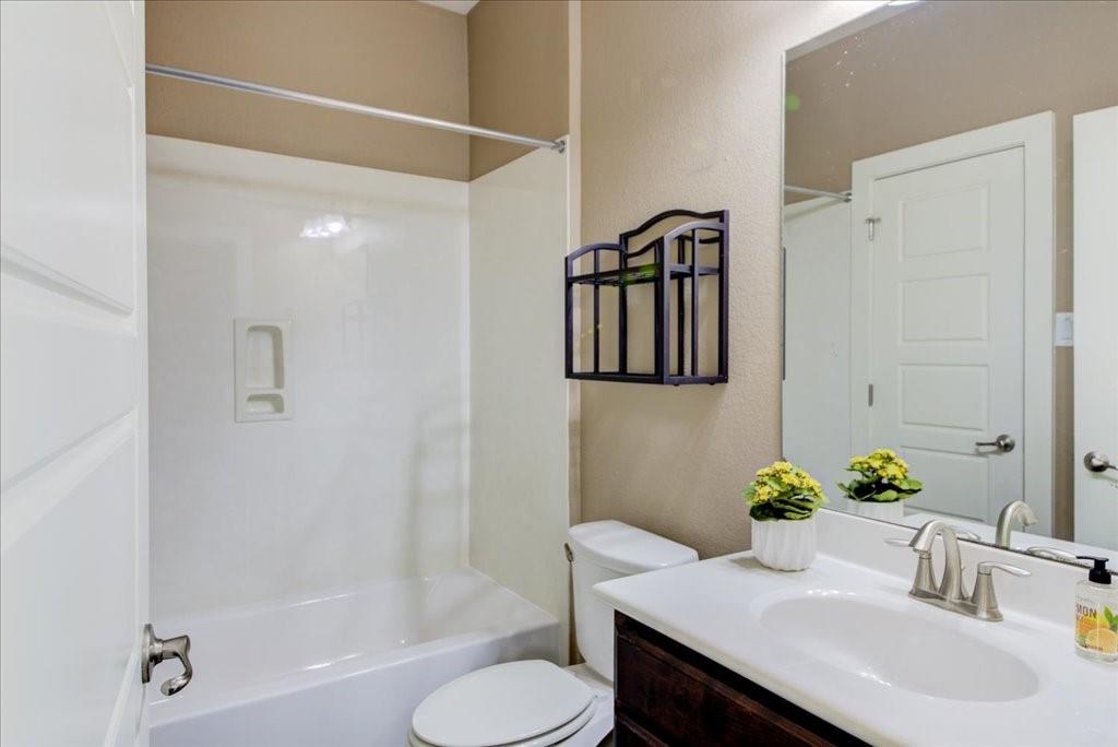 12212 Tawny Farms Road, Unit 142 Austin, TX 78748 - Photo 24 of 38 a bathroom with a sink toilet and shower