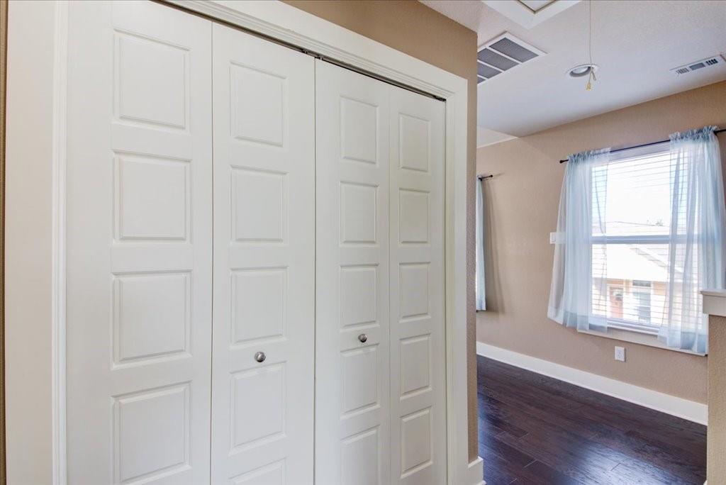 12212 Tawny Farms Road, Unit 142 Austin, TX 78748 - Photo 26 of 38 a view of an empty room with wooden floor and a window
