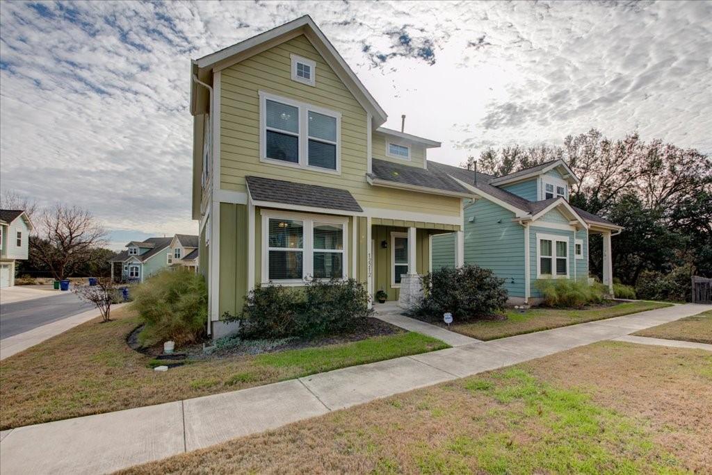12212 Tawny Farms Road, Unit 142 Austin, TX 78748 - Photo 38 of 38 a front view of a house with garden