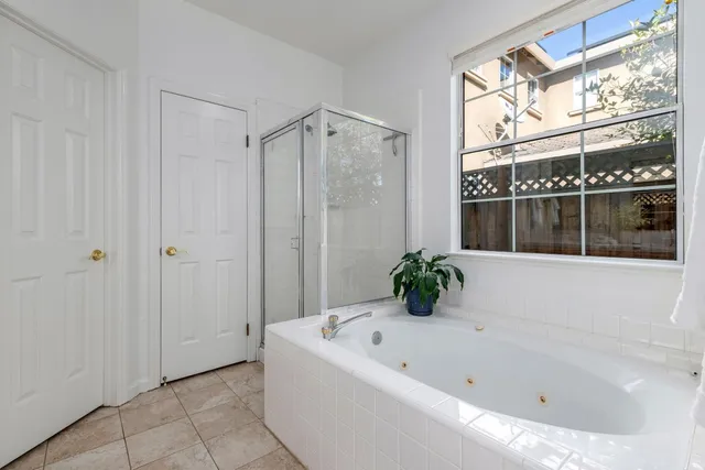 a bathroom with a bathtub and shower