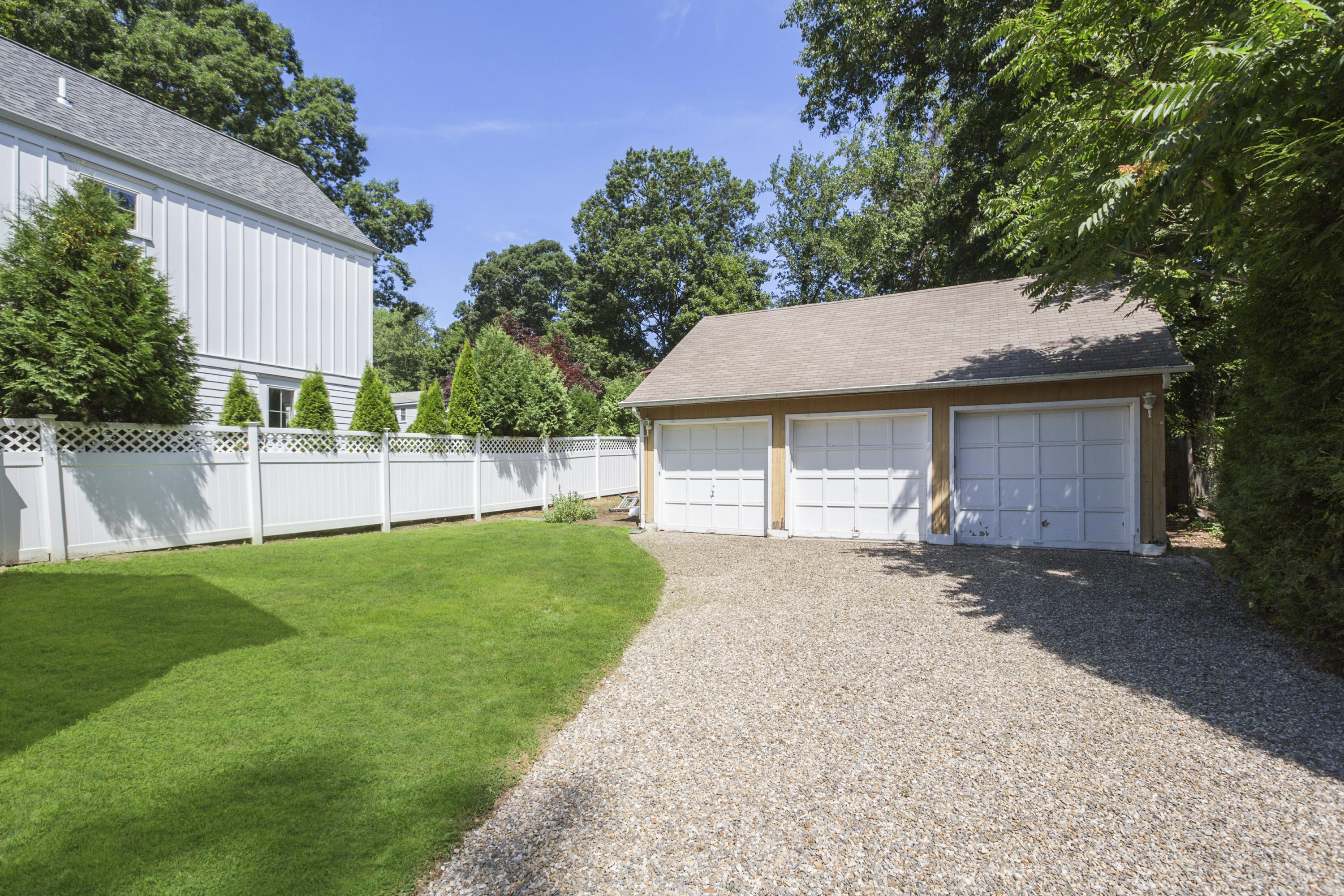 28 Edgewood Road Darien, CT 06820 - Photo 19 of 23 a front view of a house with a garden and yard