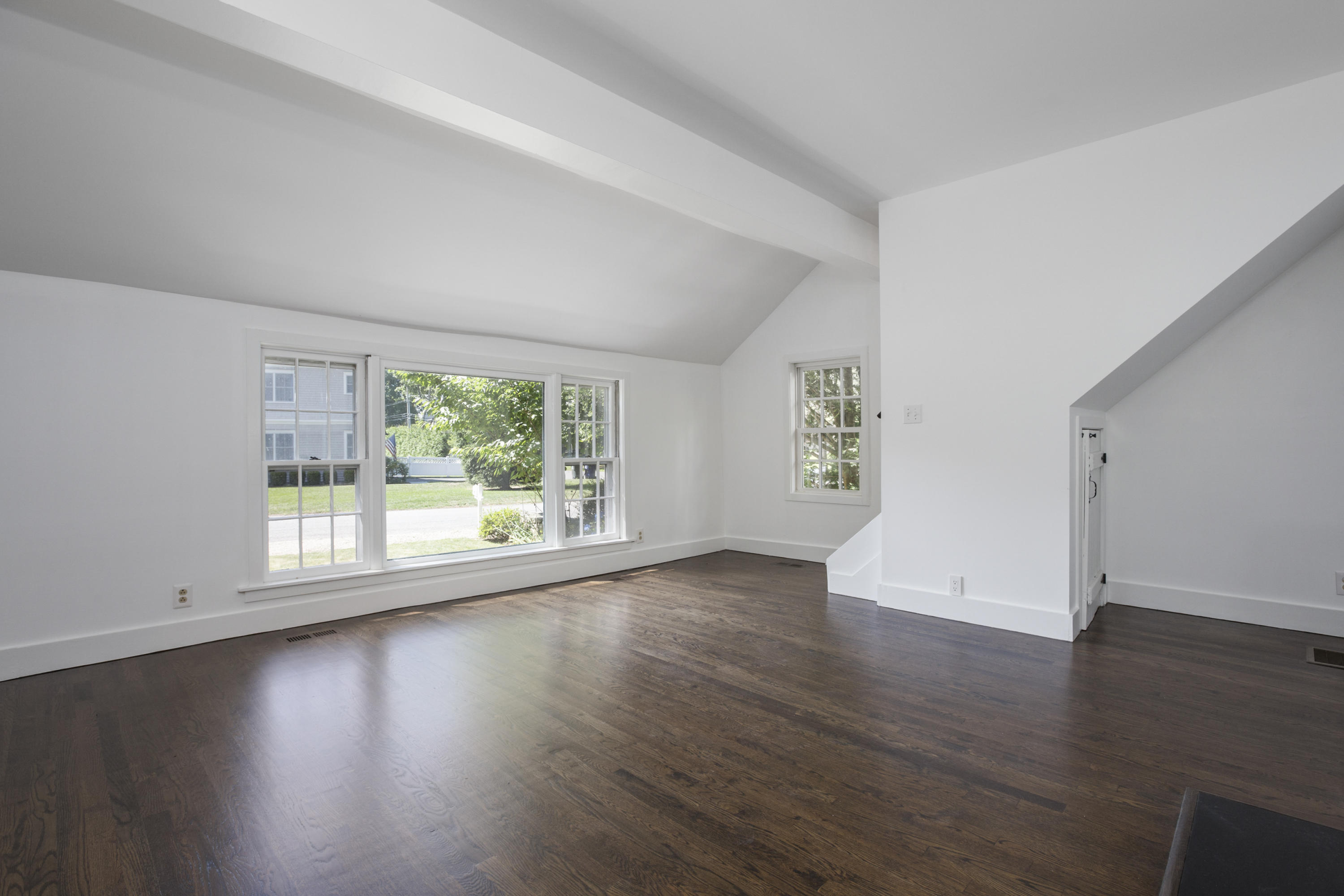 28 Edgewood Road Darien, CT 06820 - Photo 7 of 23 an empty room with wooden floor and windows