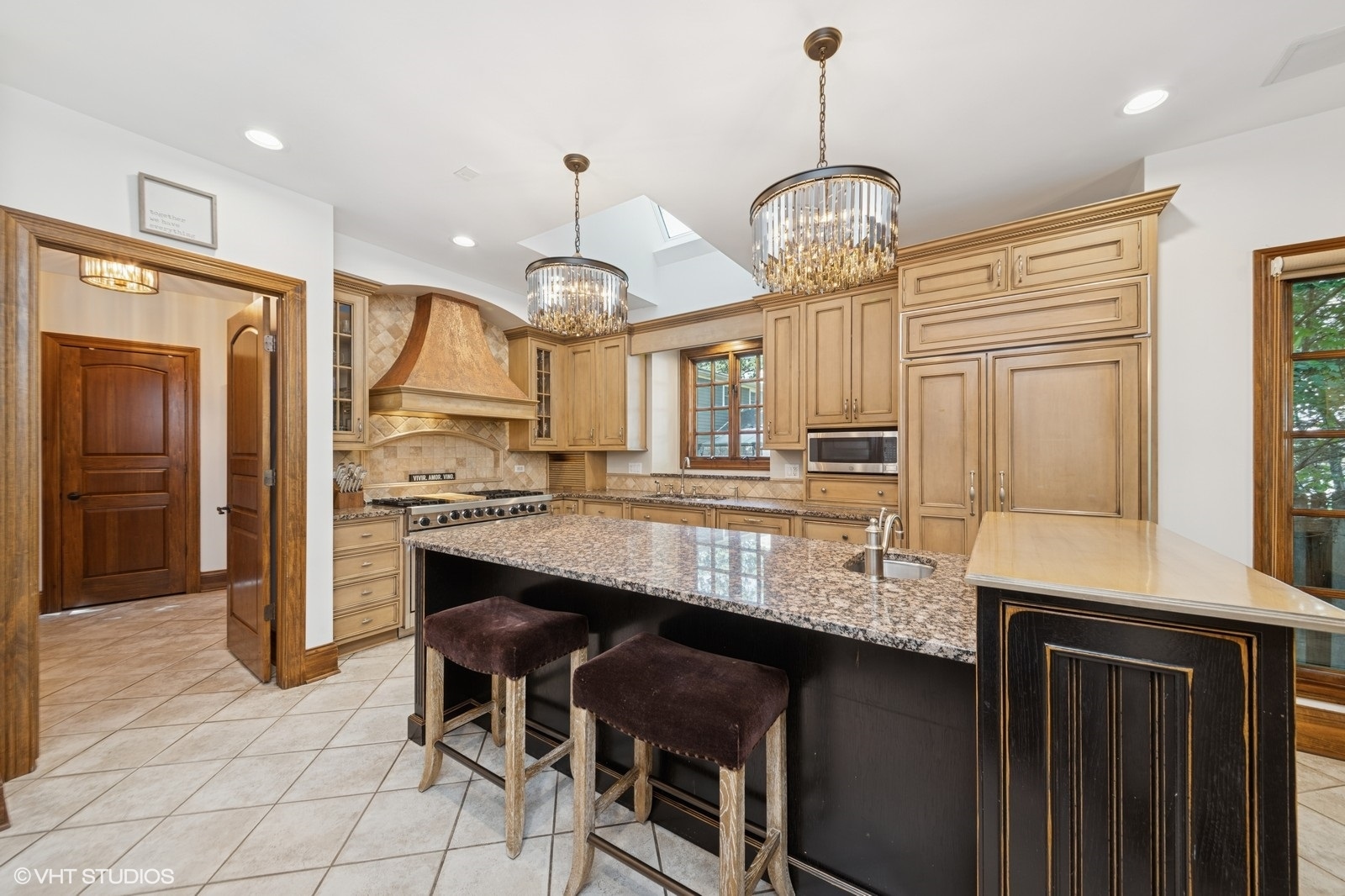 580 Oak Street Glen Ellyn, IL 60137 - Photo 23 of 93 a kitchen with stainless steel appliances granite countertop a stove refrigerator and cabinets