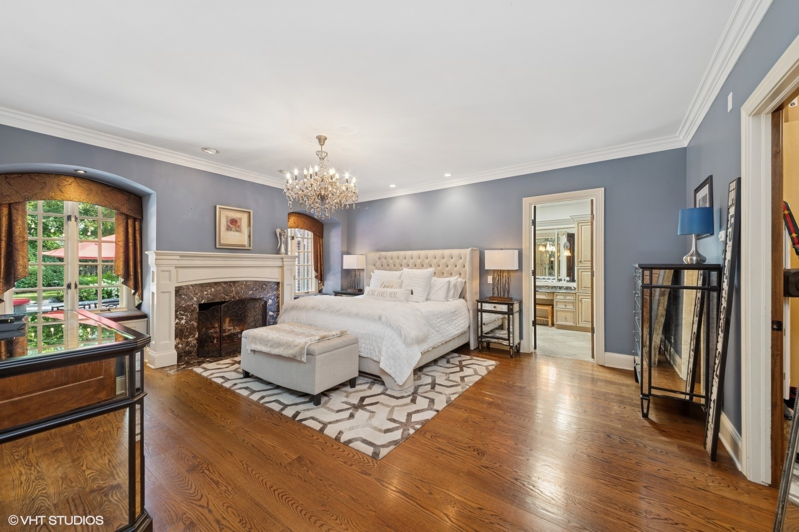 580 Oak Street Glen Ellyn, IL 60137 - Photo 32 of 93 a spacious bedroom with a bed and a fireplace